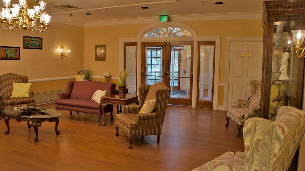 A cozy living room with comfortable seating and wooden flooring.