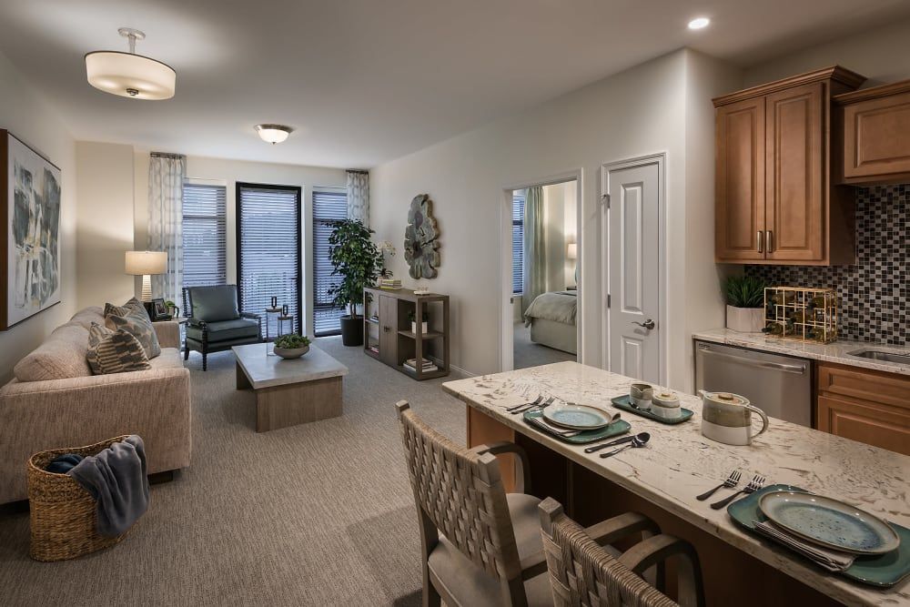 A modern open-plan living and dining area with stylish decor and neutral tones.