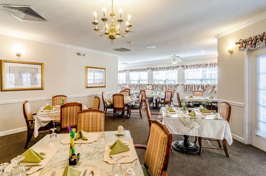 Elegant dining area with neatly arranged tables and classic decor.