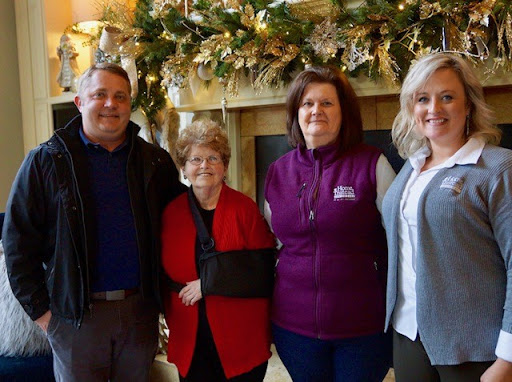 A joyful gathering surrounded by festive decorations.
