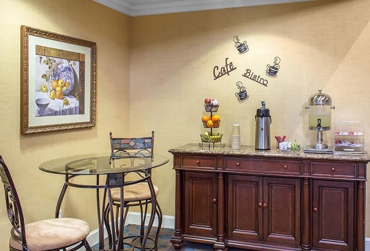 Cozy coffee station with decorative elements and seating.