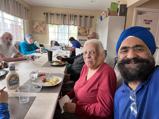 Enjoying a meal together in a lively communal setting.