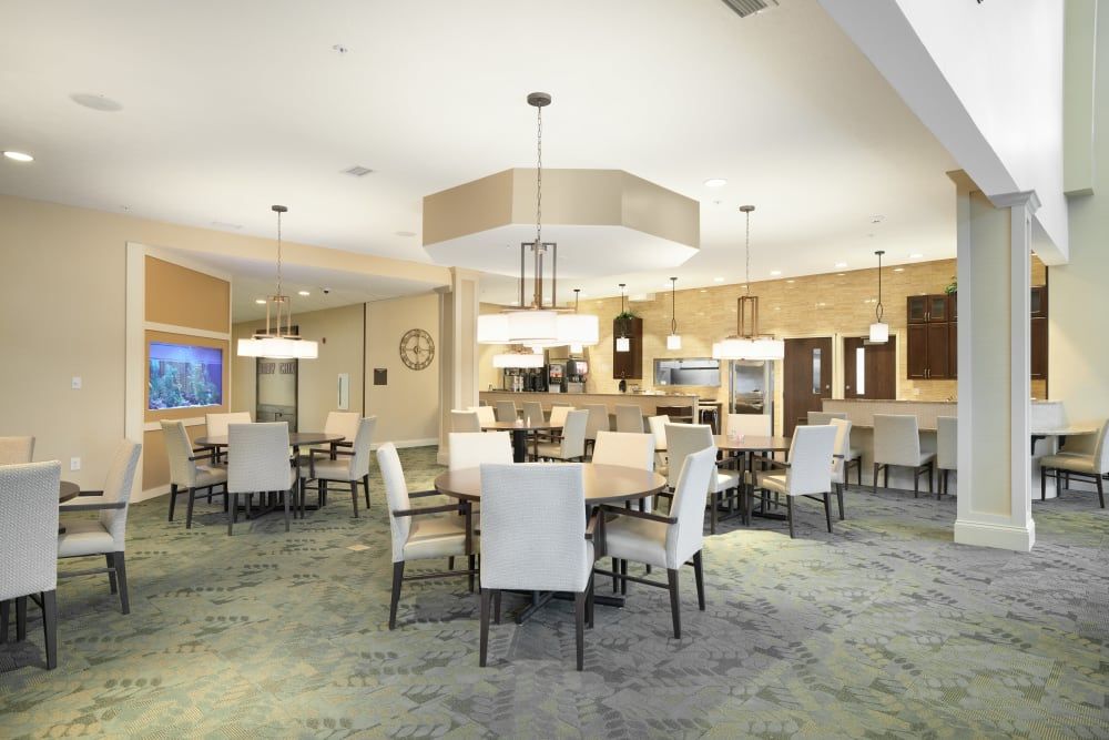 A modern dining area with elegant furnishings and lighting.