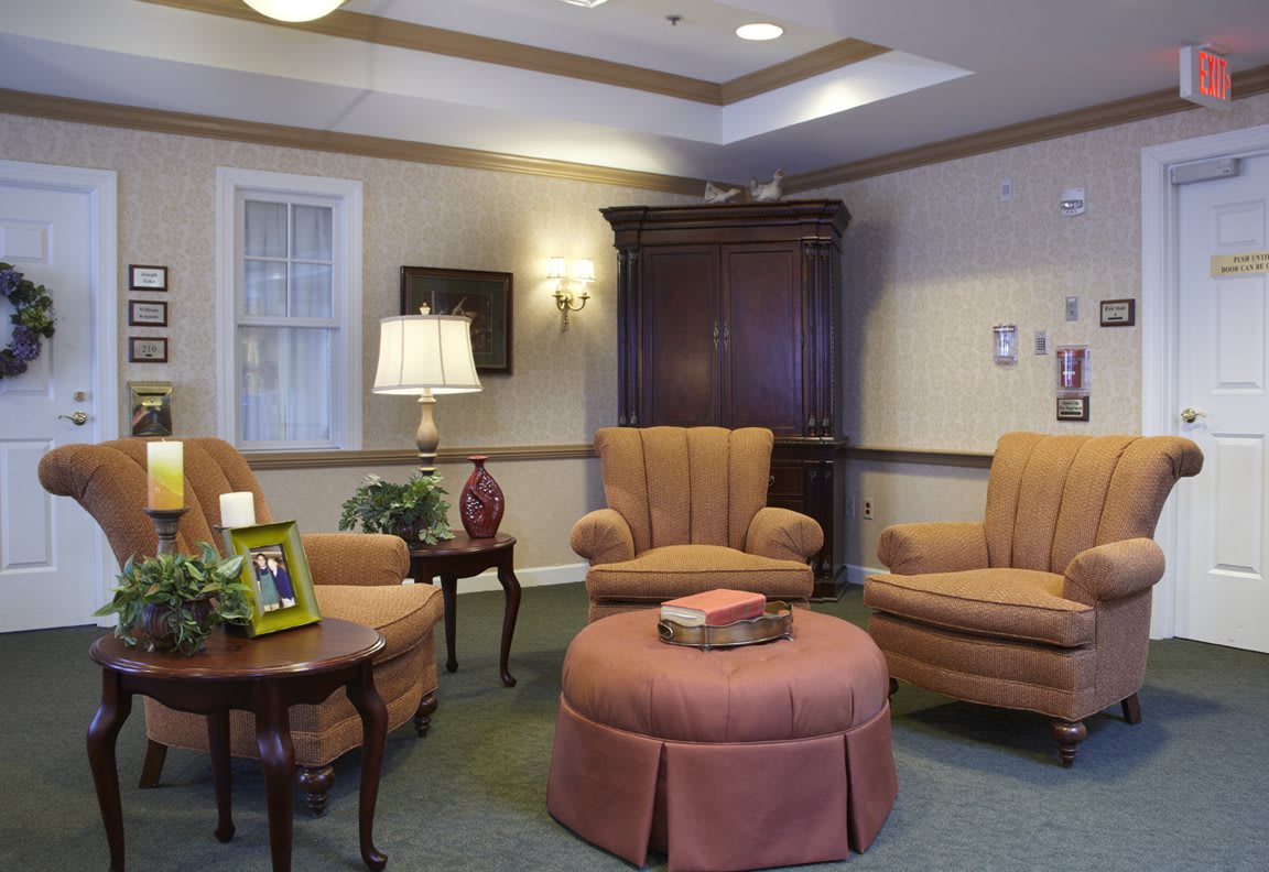 A cozy living room with comfortable seating and warm lighting.