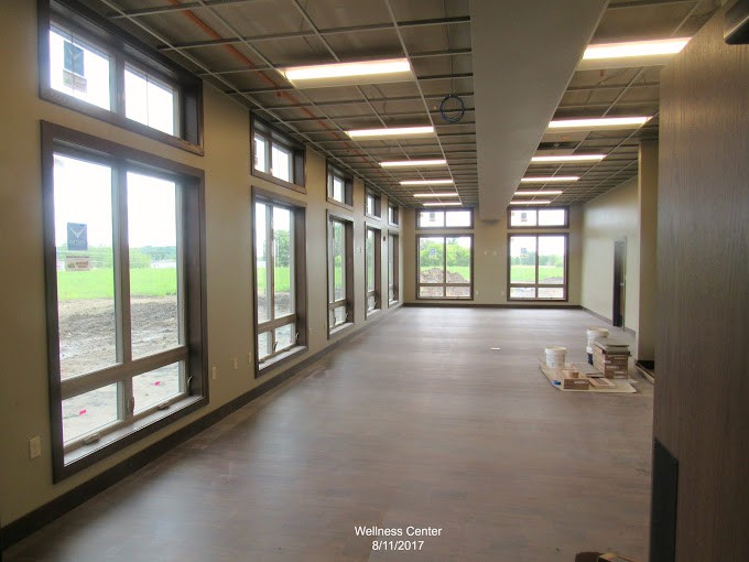 A spacious, modern interior with large windows allowing ample natural light.