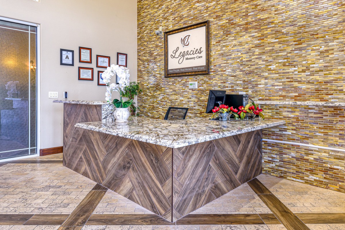 A modern reception desk in a well-decorated office interior.