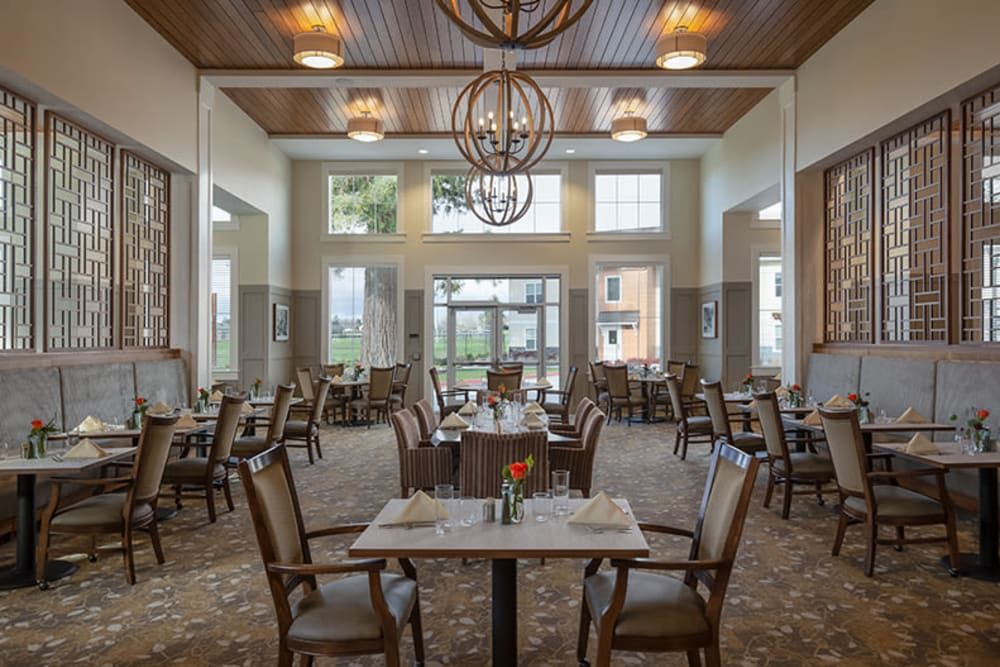 A spacious dining room with elegant decor and ample seating.