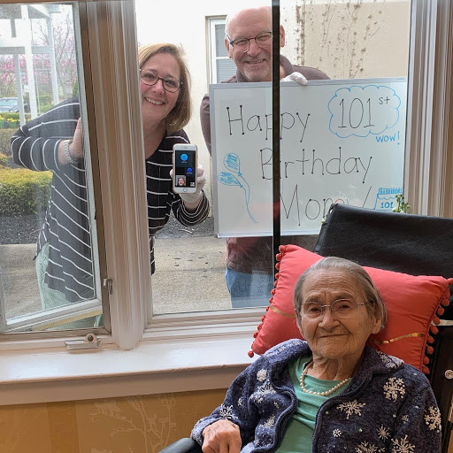 A joyful reunion through the window, celebrating togetherness and love.