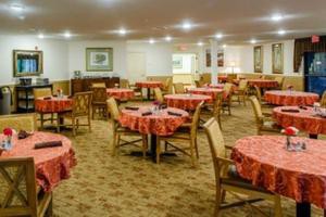An indoor dining area with neatly arranged tables and chairs.