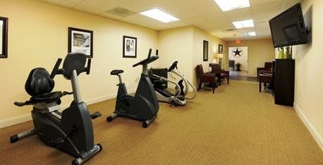 An indoor gym with exercise bikes and cardio machines.