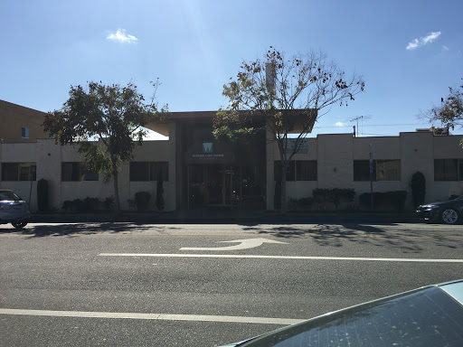A modern commercial building captured during the day.