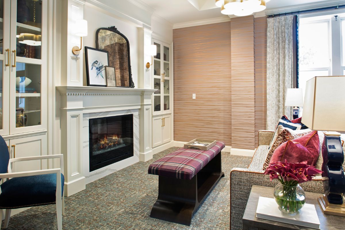 A cozy living room with a stylish fireplace and elegant decor.