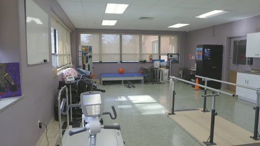 A well-equipped physical therapy room designed for rehabilitation exercises.