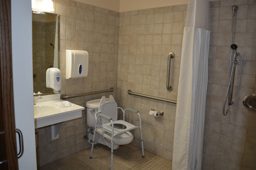 An accessible bathroom equipped with safety features.