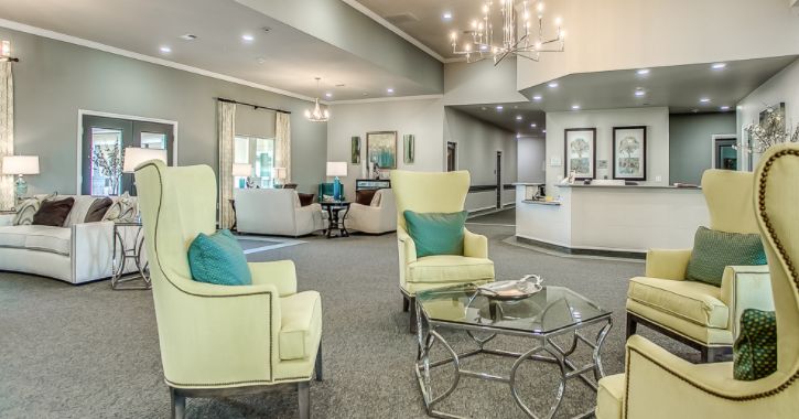 A modern living room with comfortable seating and elegant lighting.