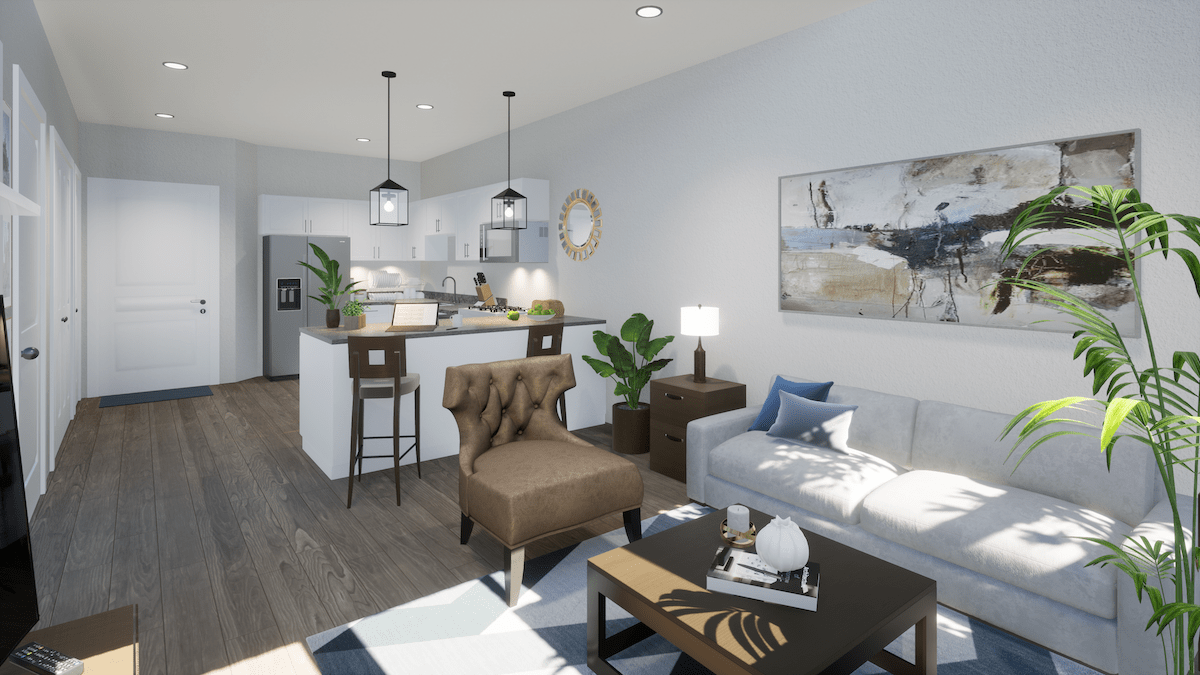 Modern open-concept living room and kitchen area with stylish furniture and decor.