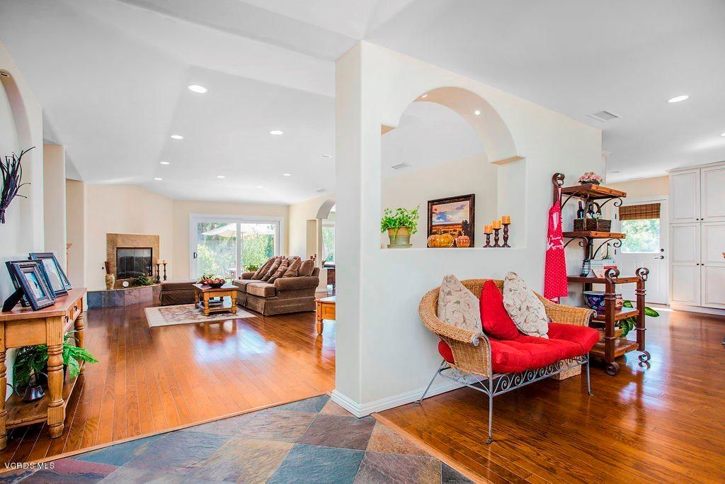 A spacious and modern living room with cozy furniture and stylish decor.