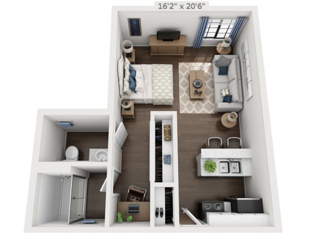 A spacious studio apartment floor plan featuring a bedroom, living area, kitchen, and bathroom.