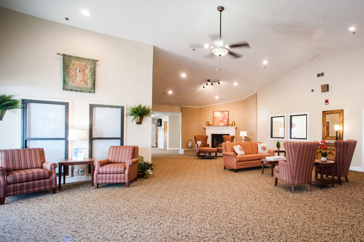 A spacious lobby area with comfortable seating and warm lighting.