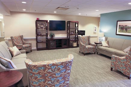 A cozy living room with comfortable seating and a television.