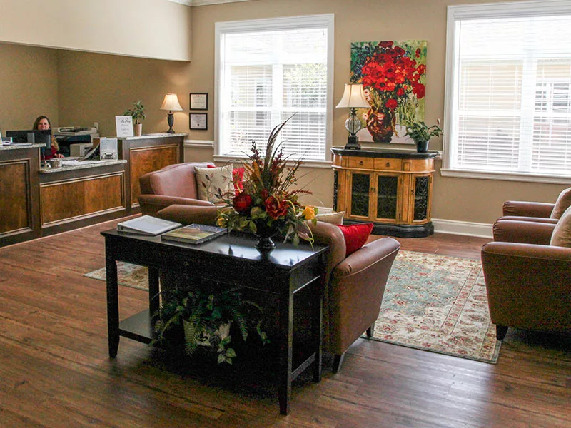 A cozy living room with elegant furniture and warm decor.