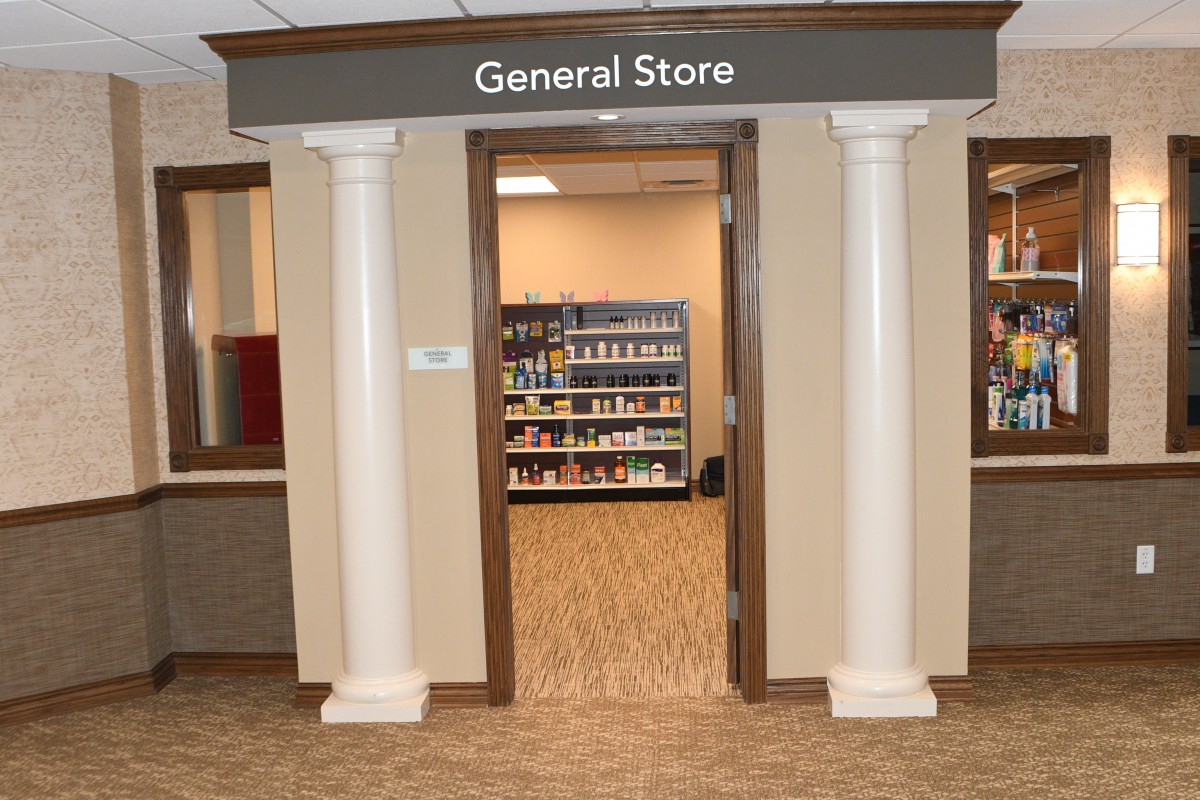 Entrance to a general store with shelves visible inside.