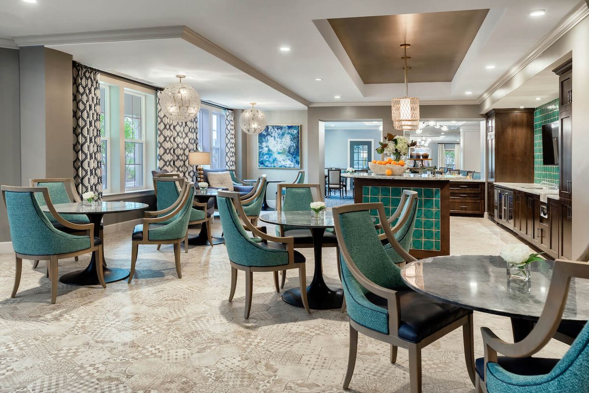 A modern dining area featuring elegant seating and stylish decor.