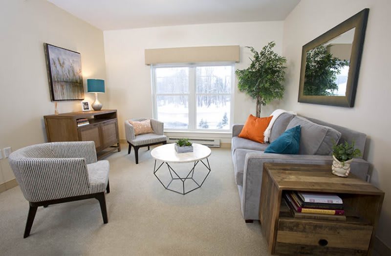 A cozy living room with modern furniture and bright natural lighting.