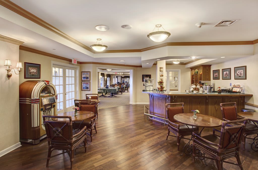 Spacious and welcoming lobby with elegant wood flooring and comfortable seating arrangements.