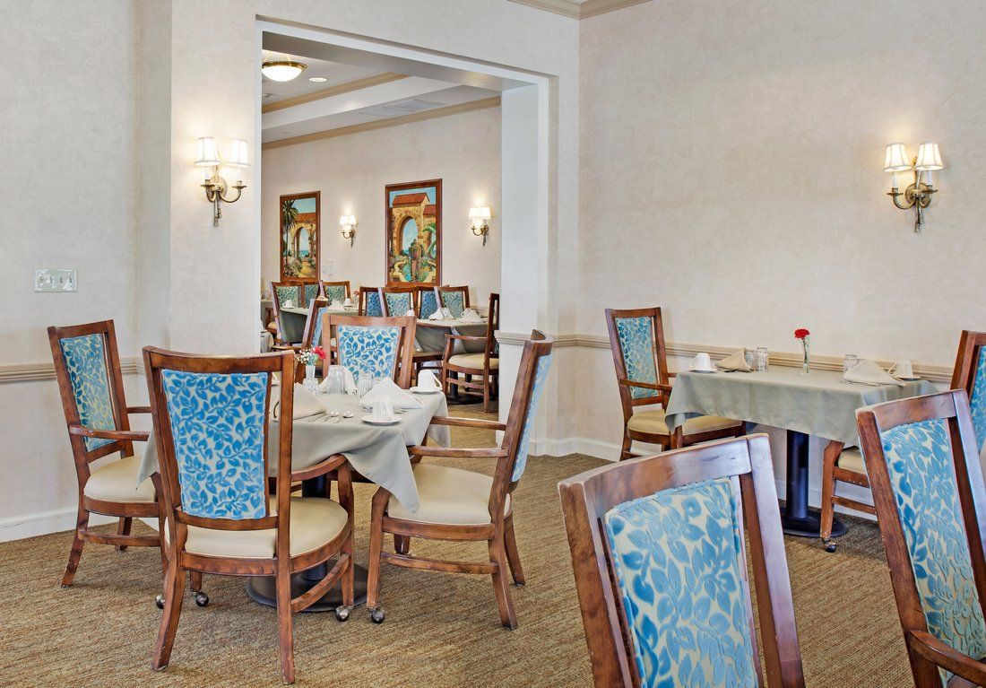 A spacious dining area with elegant decor and neatly arranged tables and chairs.