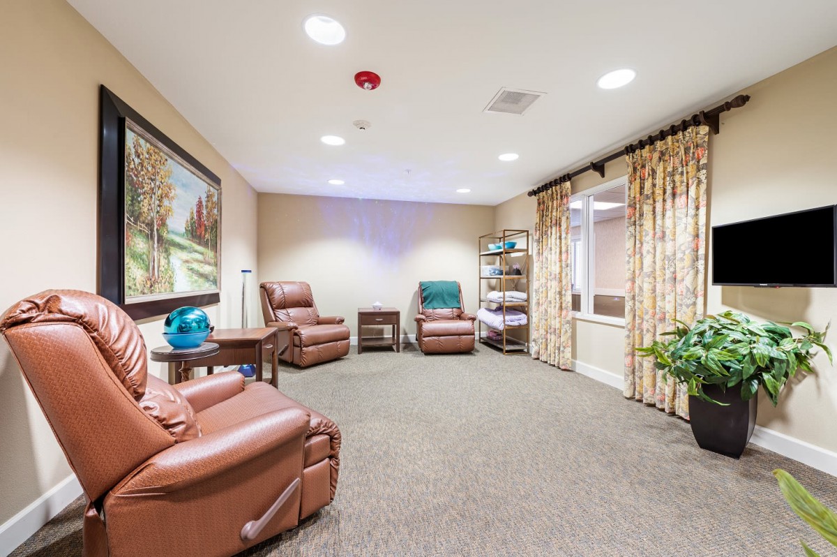 A cozy room with comfortable armchairs and warm lighting.