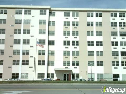 A multi-story residential apartment building with multiple windows.