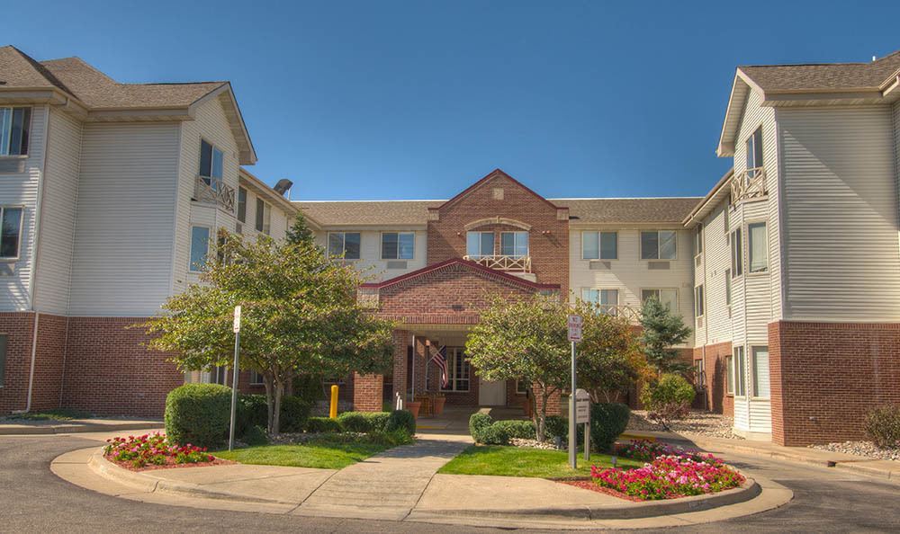 A well-maintained residential building with a welcoming entrance and landscaped surroundings.