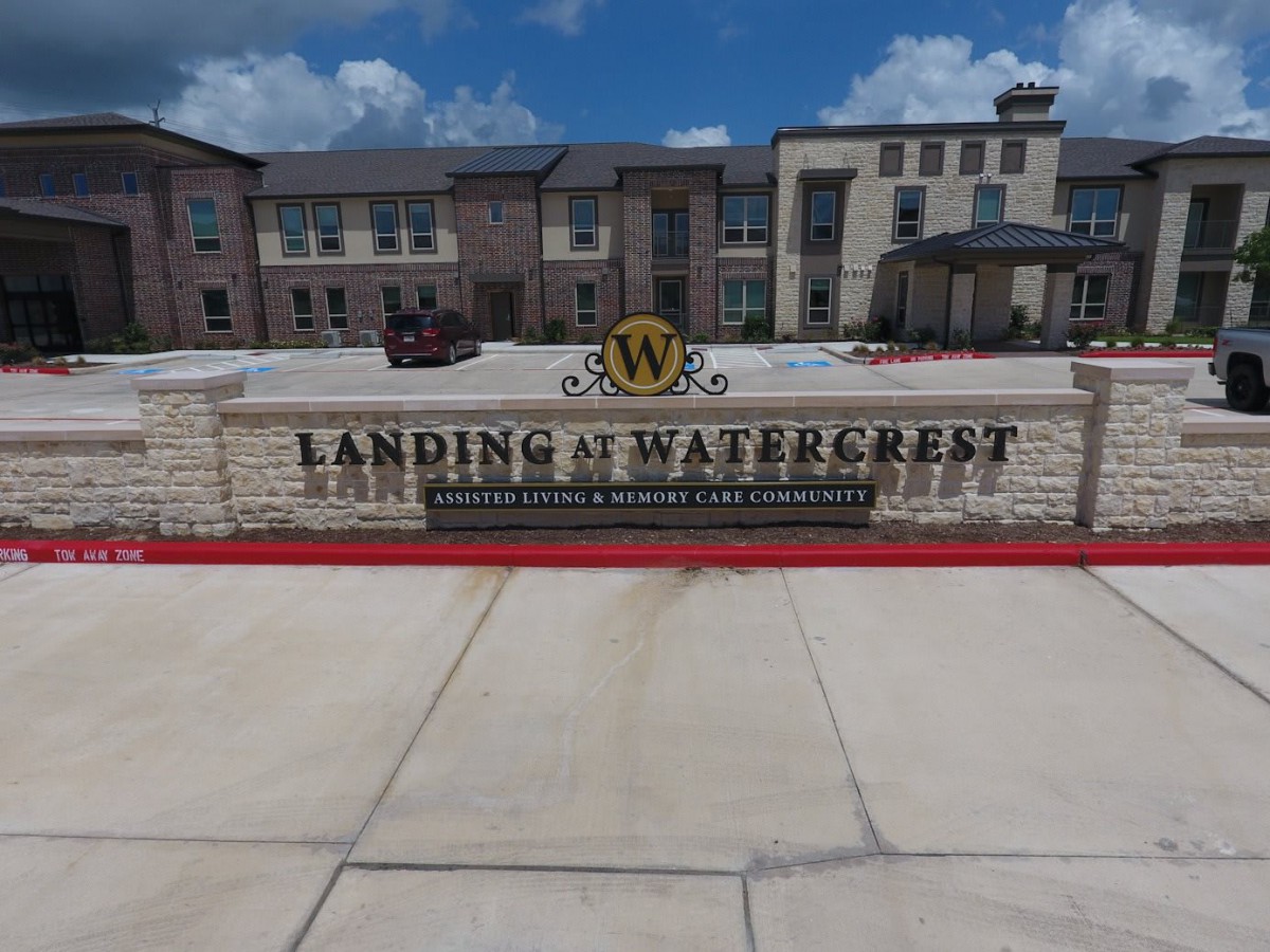 Entrance sign of Landing at Watercrest apartment complex.