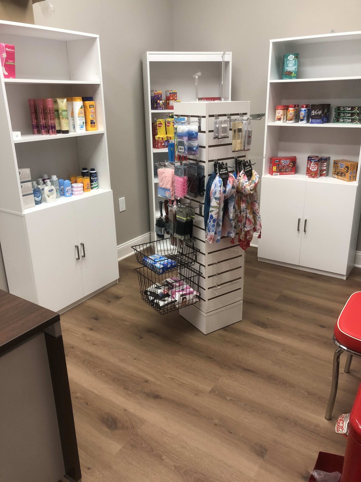 A small retail store showcasing a variety of products on shelves and racks.
