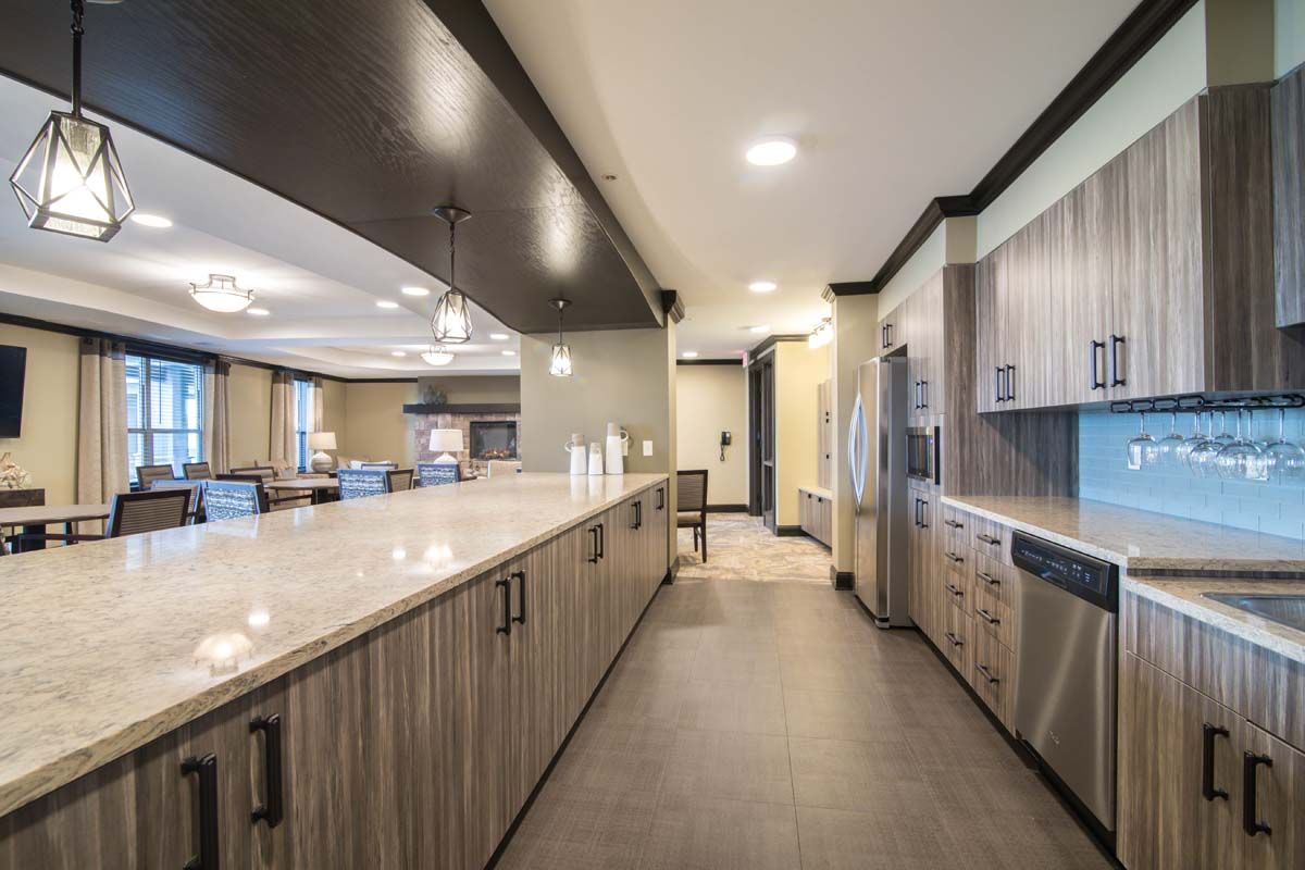 A spacious and modern kitchen featuring sleek countertops and stainless steel appliances.