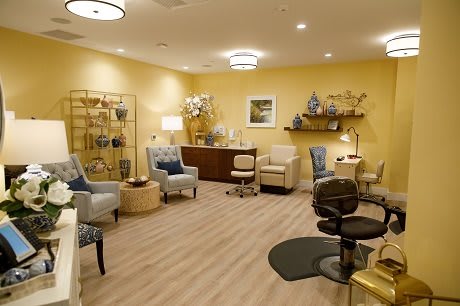 A cozy waiting room with comfortable seating and warm lighting.
