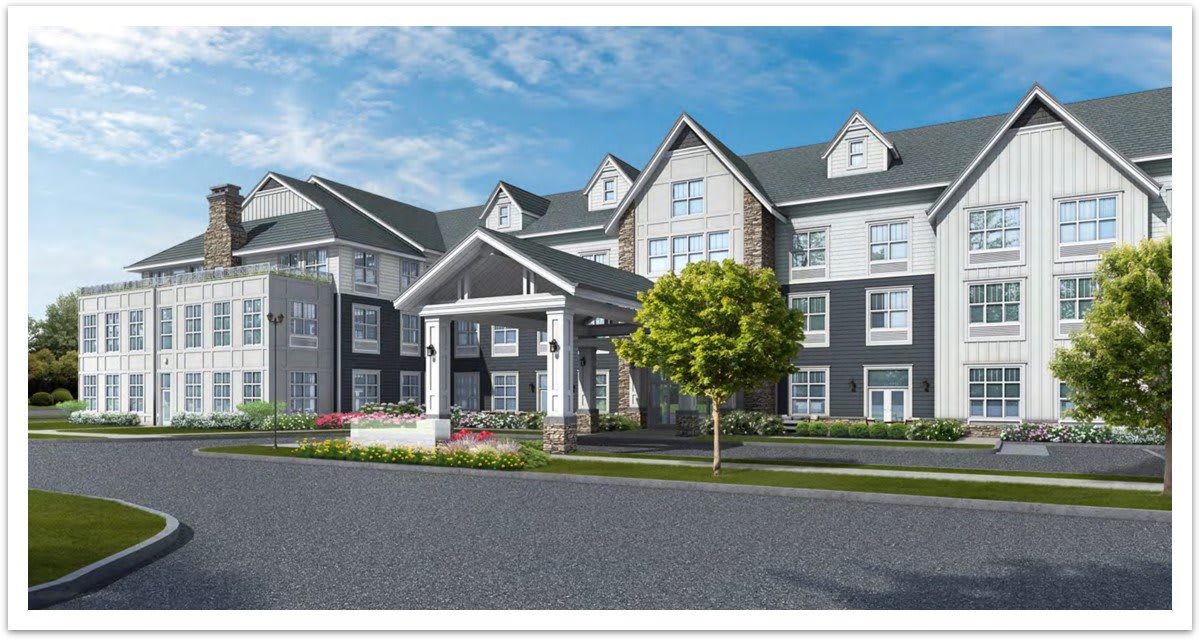 A modern residential building with a landscaped exterior and entrance.