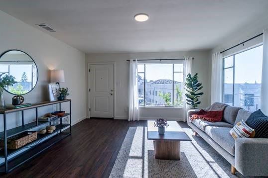 A bright and modern living room with minimalist decor and ample natural light.
