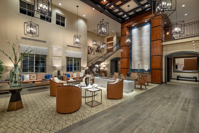 A modern hotel lobby featuring stylish seating and elegant lighting.