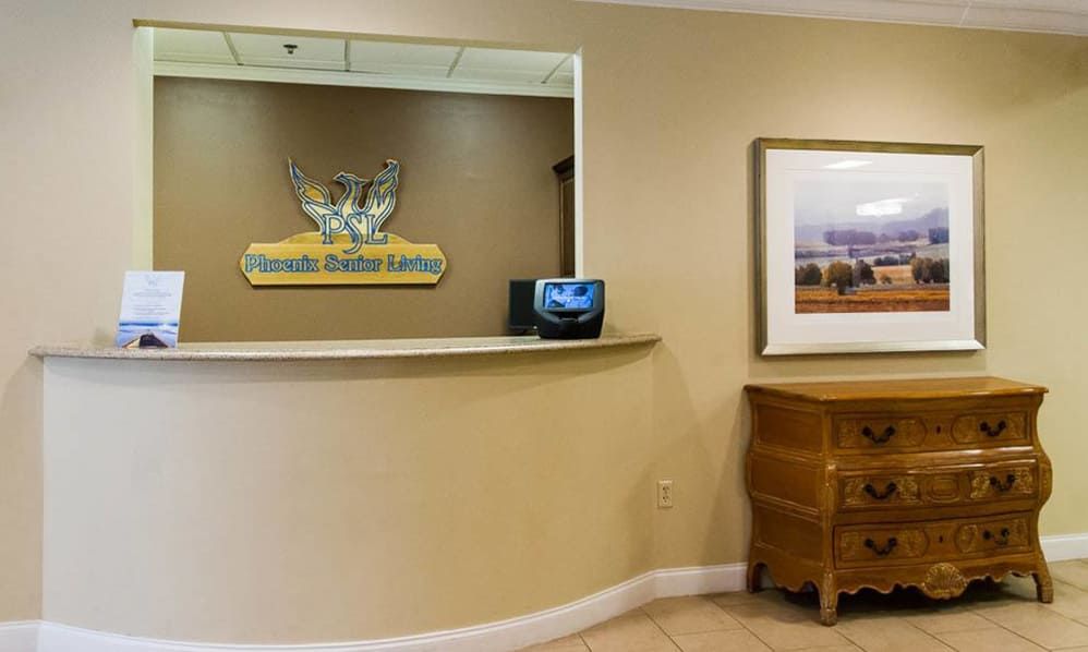 A modern reception area with a front desk and decoration.