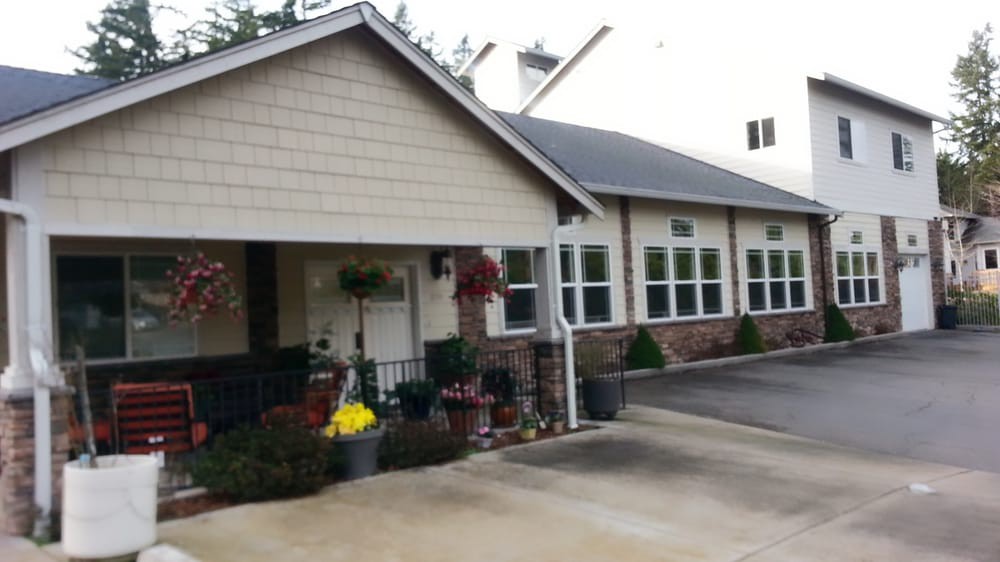 A suburban house with a front yard and driveway.