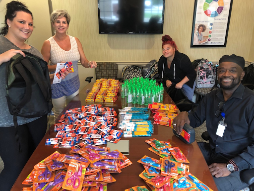 Volunteers organizing materials for a community event.