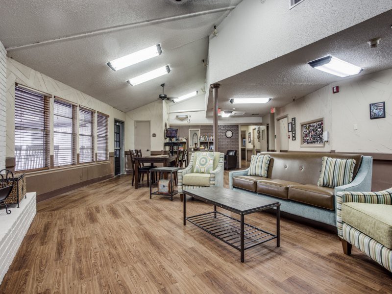 A spacious living room with modern decor and an open dining area.