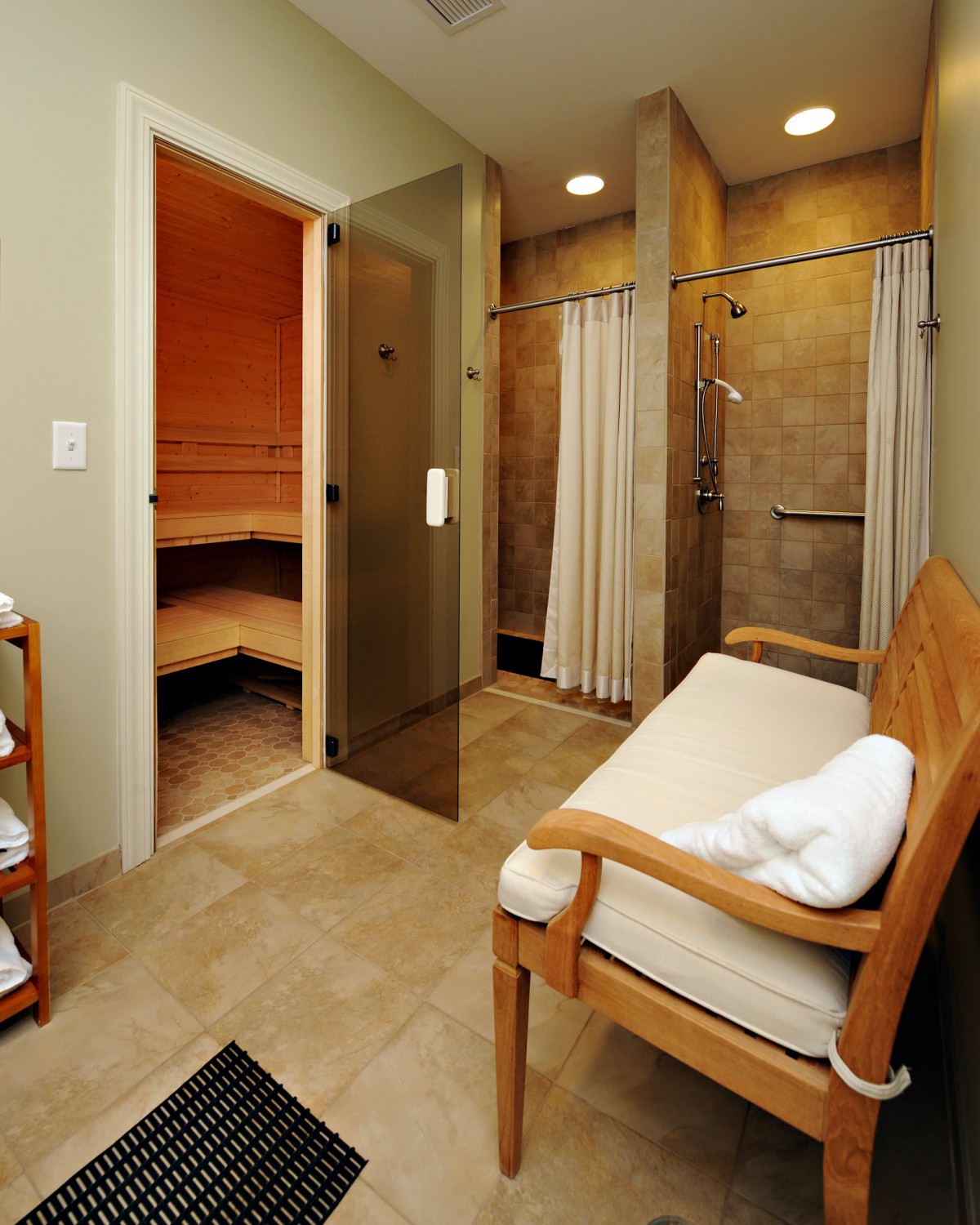 A serene spa setting featuring a sauna room and shower area.
