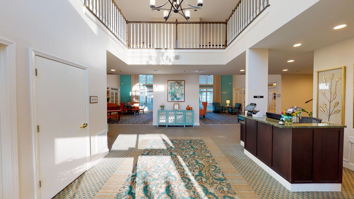 A spacious, well-lit lobby with elegant furnishings and a welcoming atmosphere.