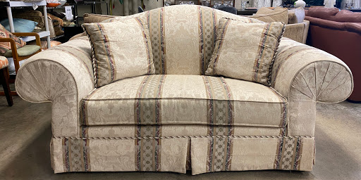 A beautifully upholstered couch with a patterned design, perfect for enhancing any living space.