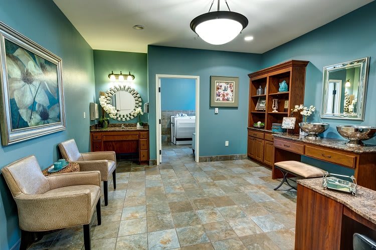 A modern waiting area with comfortable seating, decorative lighting, and a welcoming atmosphere.