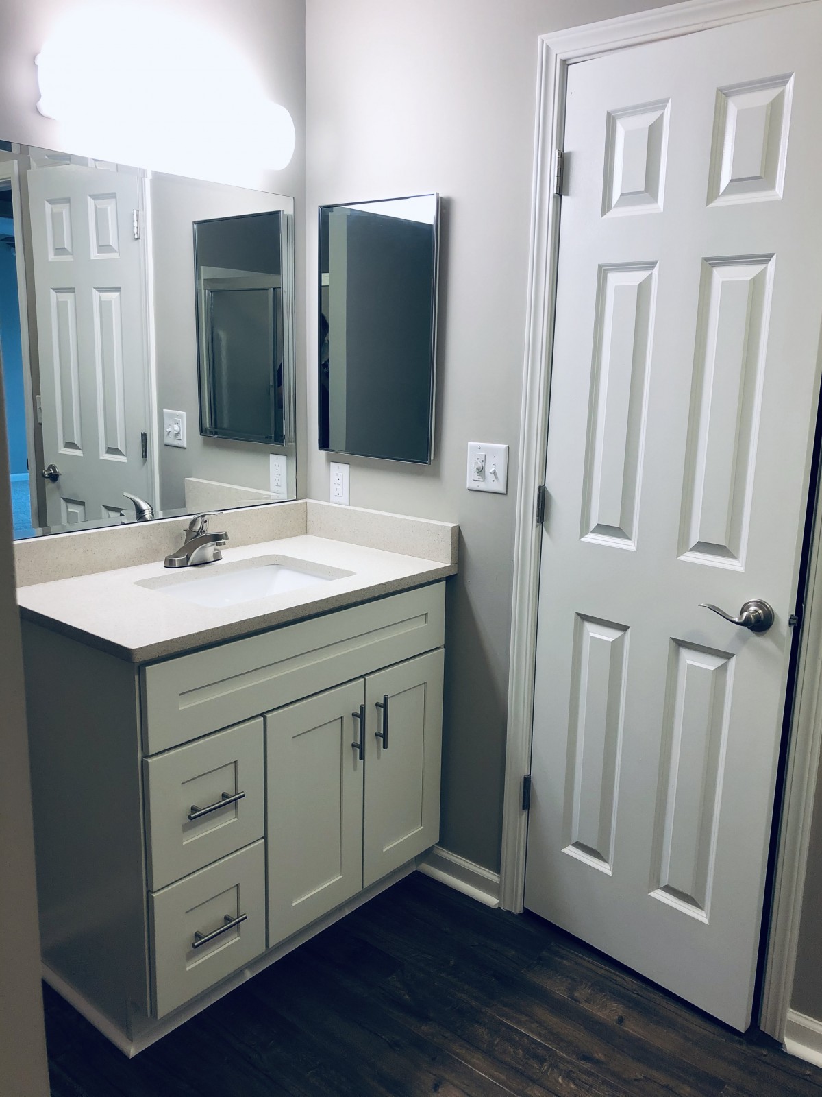 Modern bathroom with a sleek vanity and mirror.