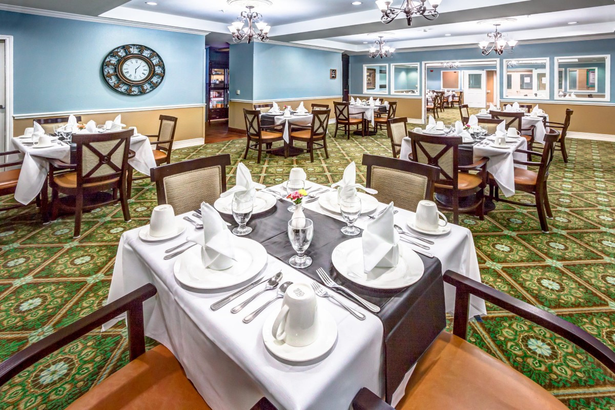 A beautifully set dining table in an elegant restaurant.